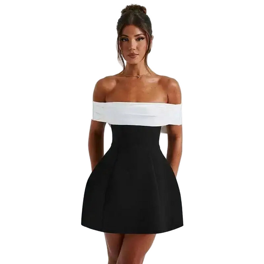 Woman wearing a black and white off-shoulder dress on a white background